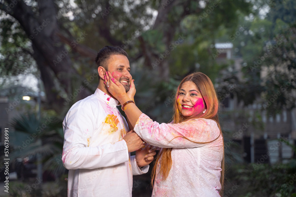 Indian people celebrate holi festival together at park. Indian people celebrate holi festival together at park.