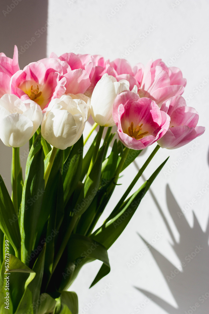 Fototapeta premium Bouquet of pink tulips, top view, spring bouquet.