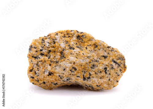 Yellow granite stone macro shot isolated on white background (diameter is about 5 cm) photo