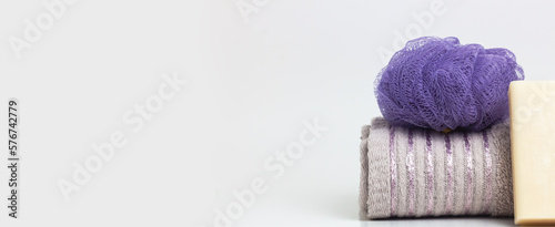 Clean towel and natural handmade soap on white background Space for text