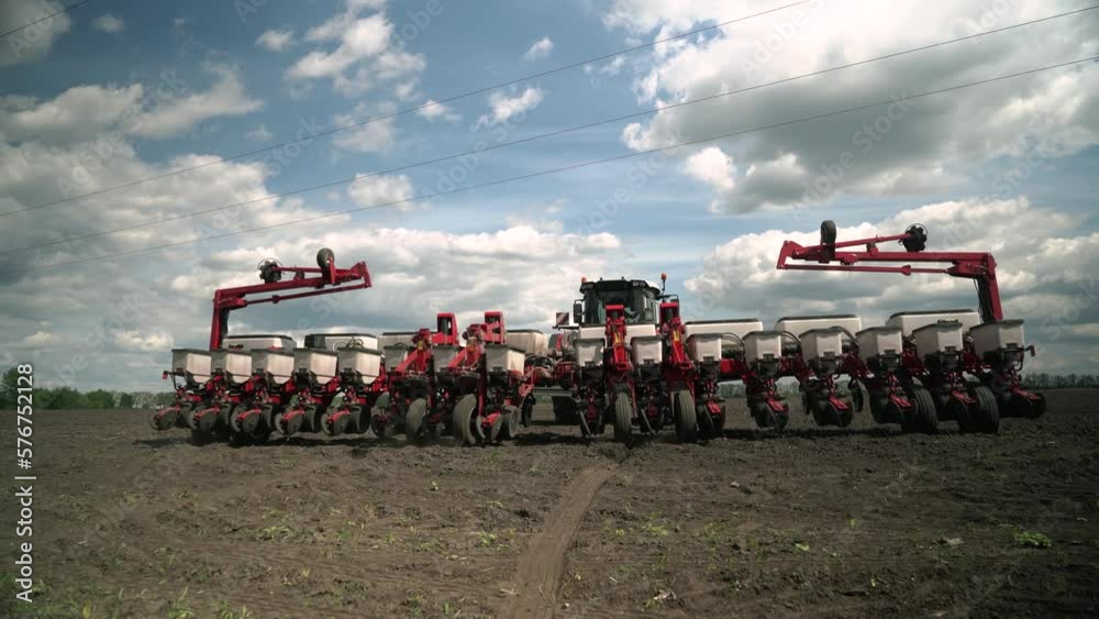 the tractor sows the field with corn grains. Preparation