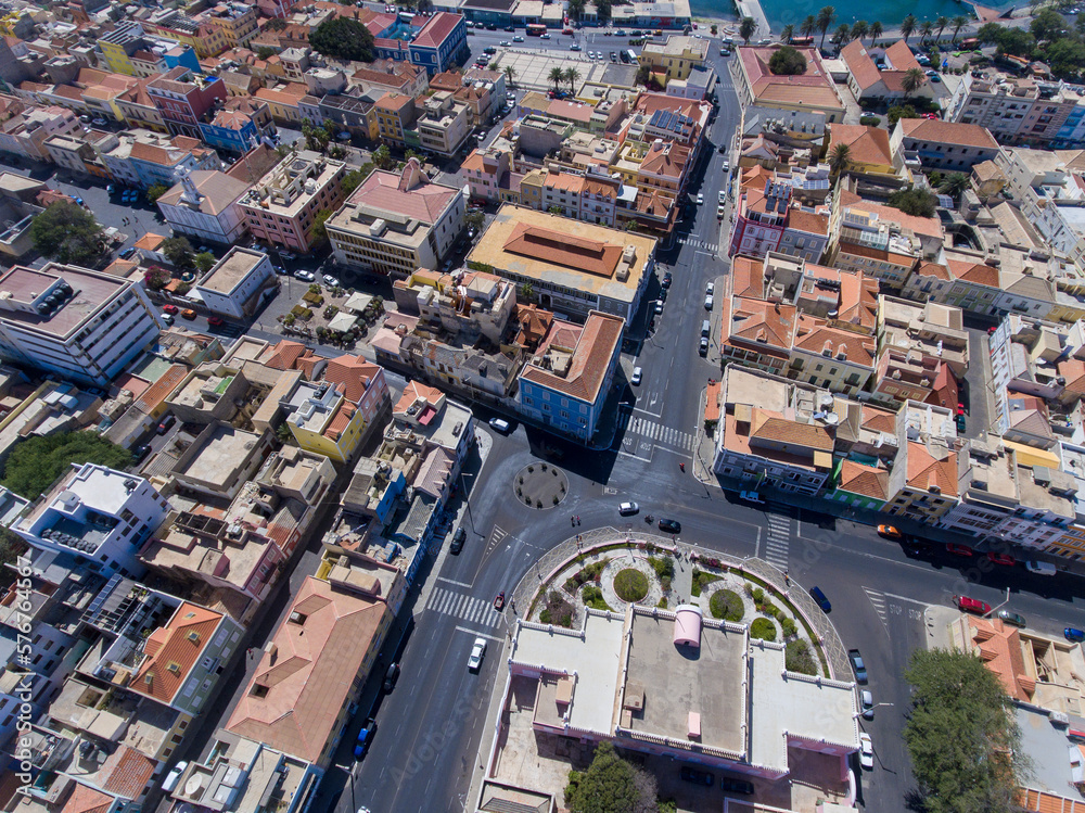 Naklejka premium The city of Mindelo, located on the island of São Vicente in Cabo Verde, is a place of vibrant landscapes. It boasts colorful streets, a bustling port, a lively cultural center with music, dance...