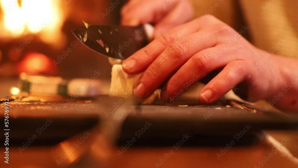 Man cooking and slicing fresh food on chopping board Man cooking and slicing fresh food on chopping board