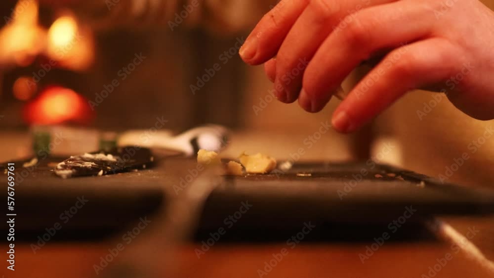 Man cooking and slicing fresh food on chopping board Man cooking and slicing fresh food on chopping board
