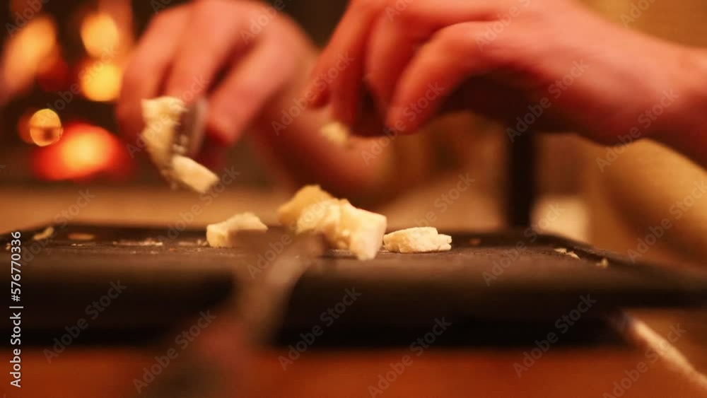 Man cooking and slicing fresh food on chopping board Man cooking and slicing fresh food on chopping board