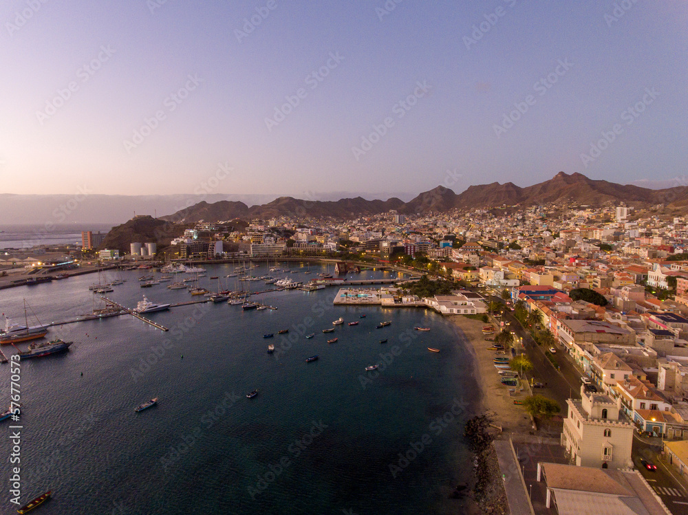 Mindelo is a picturesque city located on the island of São Vicente in Cape Verde, with stunning landscapes. It has a beautiful harbor, sandy beaches, a rugged coastline, and a mountainous backdrop. Mindelo is a picturesque city located on the island of São Vicente in Cape Verde, with stunning landscapes. It has a beautiful harbor, sandy beaches, a rugged coastline, and a mountainous backdrop.