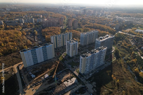 The urban area of Lobnya city in the city of Lobnya at dawn from a drone against the sun photo