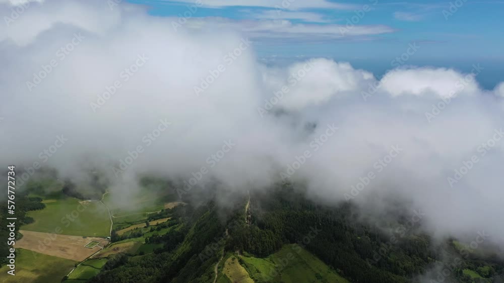 Aerial view of Lagoa Azul lake in low clouds with fog on San Miguel Island, Azores archipelagos, Portugal. Aerial view of Lagoa Azul lake in low clouds with fog on San Miguel Island, Azores archipelagos, Portugal.