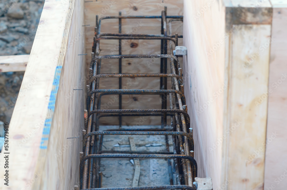 Close-up of reinforcement cage placed inside shutter and ready to be poured with concrete. Selective focus Close-up of reinforcement cage placed inside shutter and ready to be poured with concrete. Selective focus