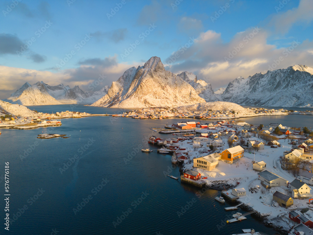 Fototapeta premium White snow mountain in Lofoten islands, Nordland county, Norway, Europe. Hills and trees, nature landscape in winter season. Winter background.