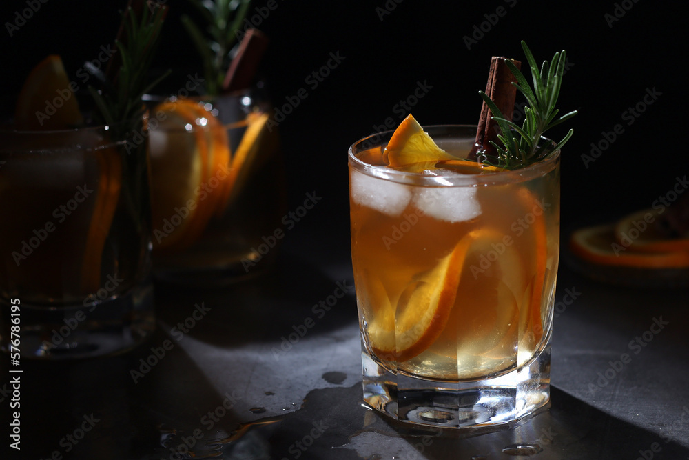 Orange rosemary bourbon cocktail in low key Orange rosemary bourbon cocktail in low key