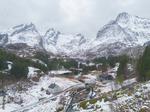 White snow mountain in Lofoten islands, Nordland county, Norway, Europe. Hills and trees, nature landscape in winter season. Winter background. photo