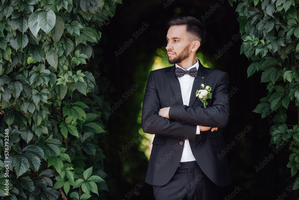 stylish groom posing at the camera stylish groom posing at the camera