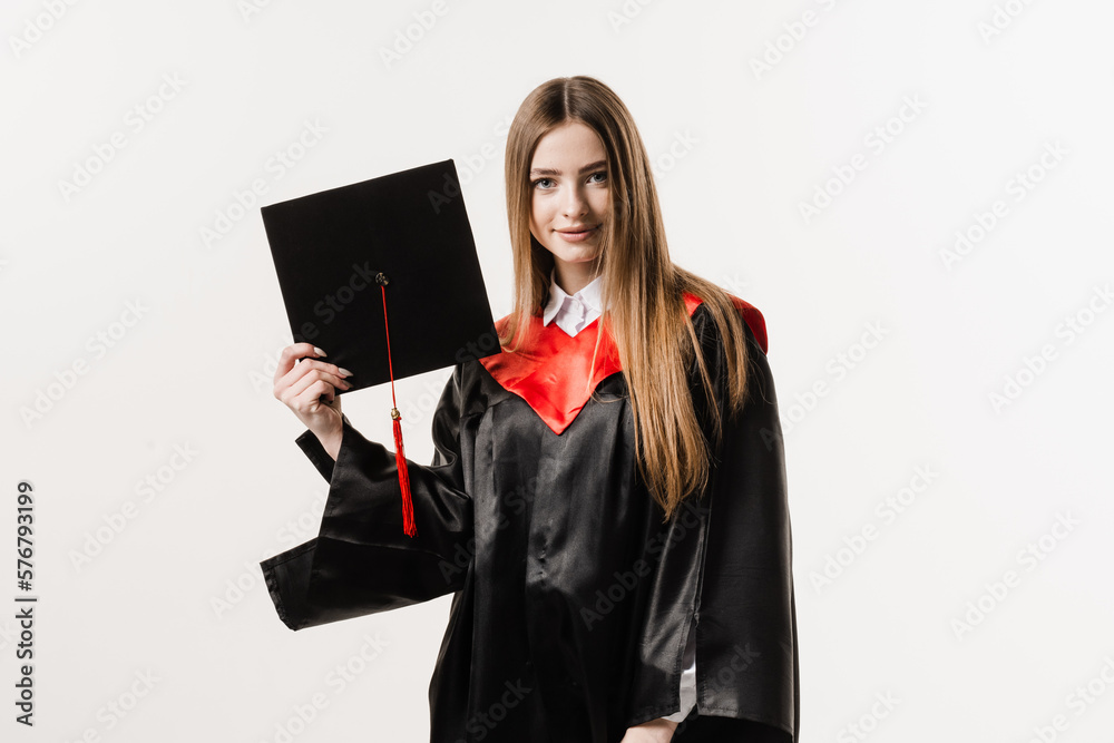 Cheerful bachelor girl in graduation robe and cap on white background. Happy and funny young woman smile. Student achieve master degree in univesity, Cheerful bachelor girl in graduation robe and cap on white background. Happy and funny young woman smile. Student achieve master degree in univesity,