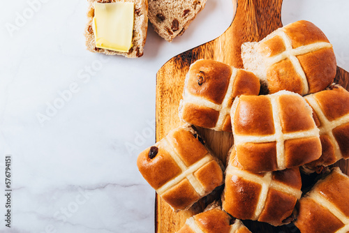 Easter Breakfast with Hot Cross Buns, served on Wooden Chopping Board. Top View