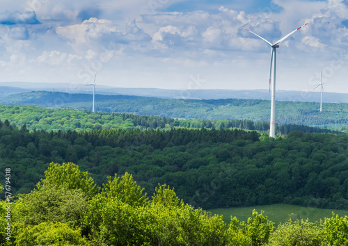 Beautiful forest landscape with wind turbines in saarland germany europe