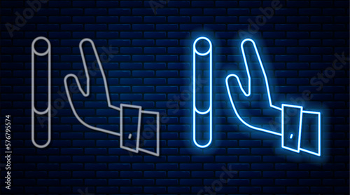 Glowing neon line Giving up cigarette icon isolated on brick wall background. Tobacco sign. Smoking symbol. Healthy lifestyle. Vector
