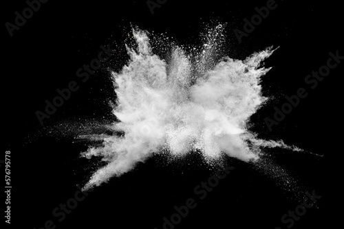 Photographie White powder explosion isolated on black background