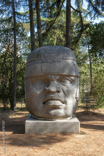 A replica of the Cabeza Colossal Olmec located in the garden of the Torre Girona, in front of the Barcelona Supercomputer Center building photo