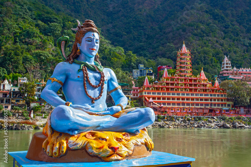 Fotografie Statue of Lord Shiva on the Ganga river bank in Rishikesh