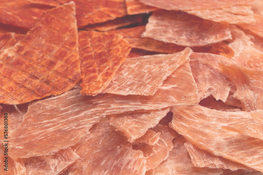 Fototapeta premium Group of tasty beer snacks. Dehydrated chicken meat slices.
