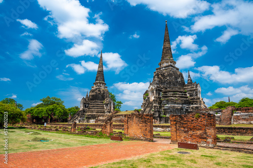 Ruins of ancient city and temples Ayutthaya, Thailand. Old kingdom of Siam. Summer day with blue sky. Famous tourist destination, spiritual place near Bangkok. © Martin