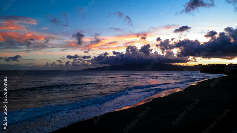 Beautiful sunset over beach in Ribiera Grande, Atlantic Ocean, Azores Islands.