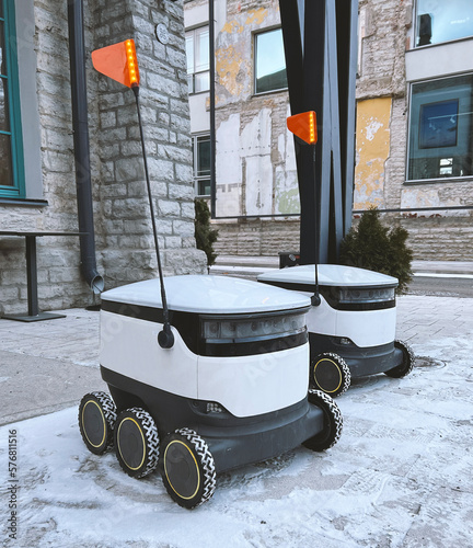 Autonomous delivery robot waiting for order at cafe or restaurant. Technology, unmanned courier robot.