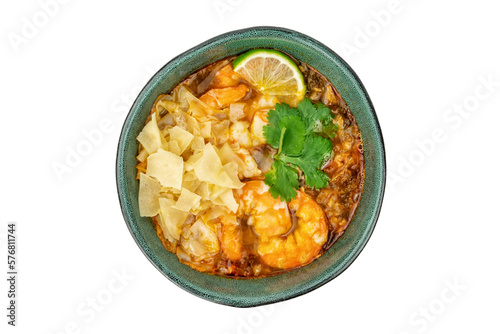 Tom Yam Kung soup with shrimps in ceramic green bowl isolated on white
