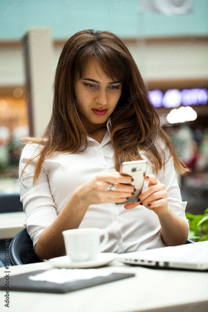 Young beautiful business woman reading messages Young beautiful business woman reading messages