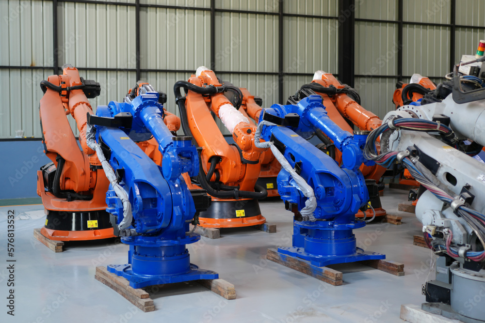 Robotic arm in futuristic assembly manufacturing factory, in factory shop floor. Robotic arm in futuristic assembly manufacturing factory, in factory shop floor.