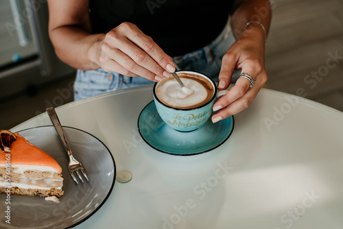 woman details hands drinking coffee eating cakes and macaroons popsi nails inspo aesthetic