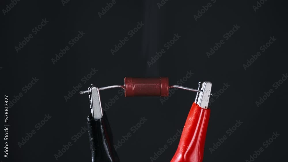 The resistor heats up with smoke under a high electric current, short
