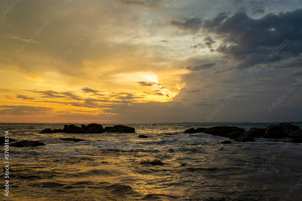 Beautiful tropical sunset on the sandy coast
