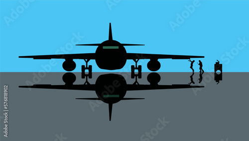 Airplane maintenance is the focus of this image where a plane in a hanger is being serviced.