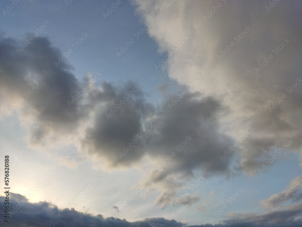 Sky with clouds being illuminated at sunset Sky with clouds being illuminated at sunset