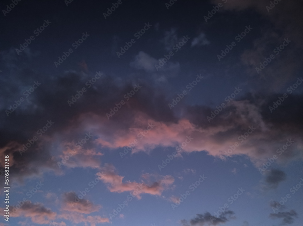 Abstract pink cloud and indigo sky hue. Dusk