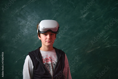 a boy playing with VR glasses
