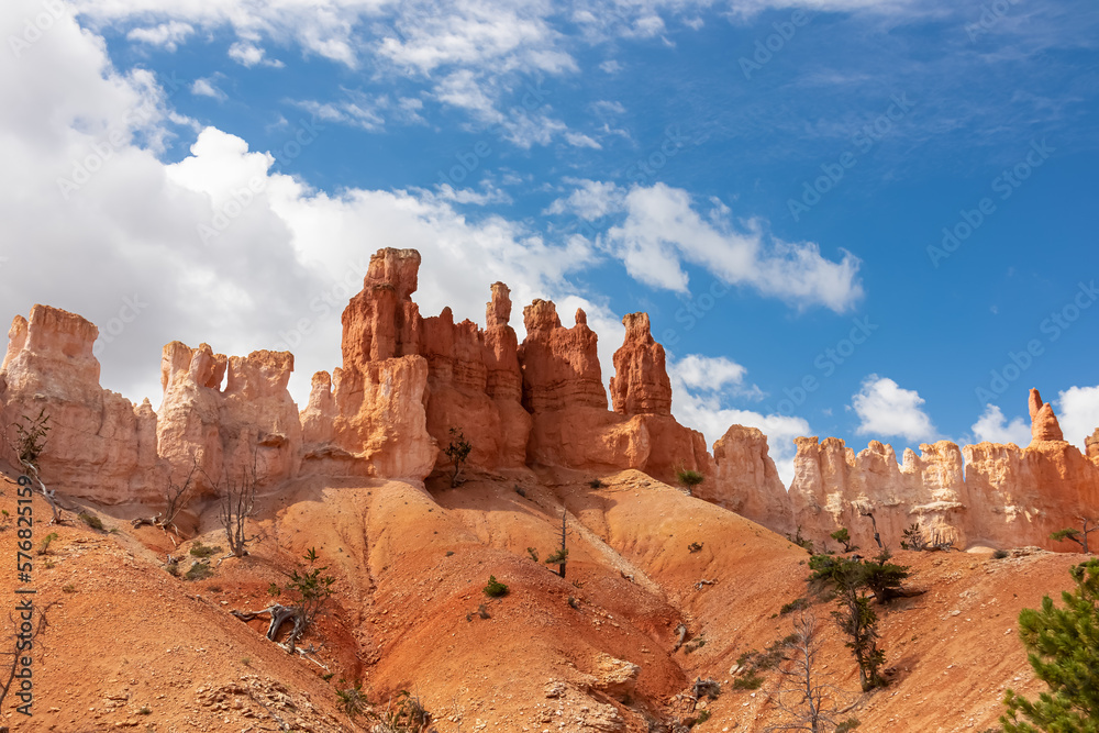 Peekaboo hiking trail with scenic view of massive steep hoodoo sandstone rock formation towers in Bryce Canyon National Park, Utah, USA. Barren desert landscape in natural amphitheatre in summer