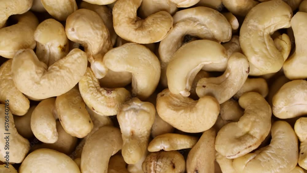 Cashew nuts as a background, top view. Cashew isolated on white background. Healthy foods. Cashew nuts as a background, top view. Cashew isolated on white background. Healthy foods.