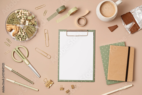 Mockup of clipboard and office supplies with white page copy space for your text. Flat lay, top view photo mock up