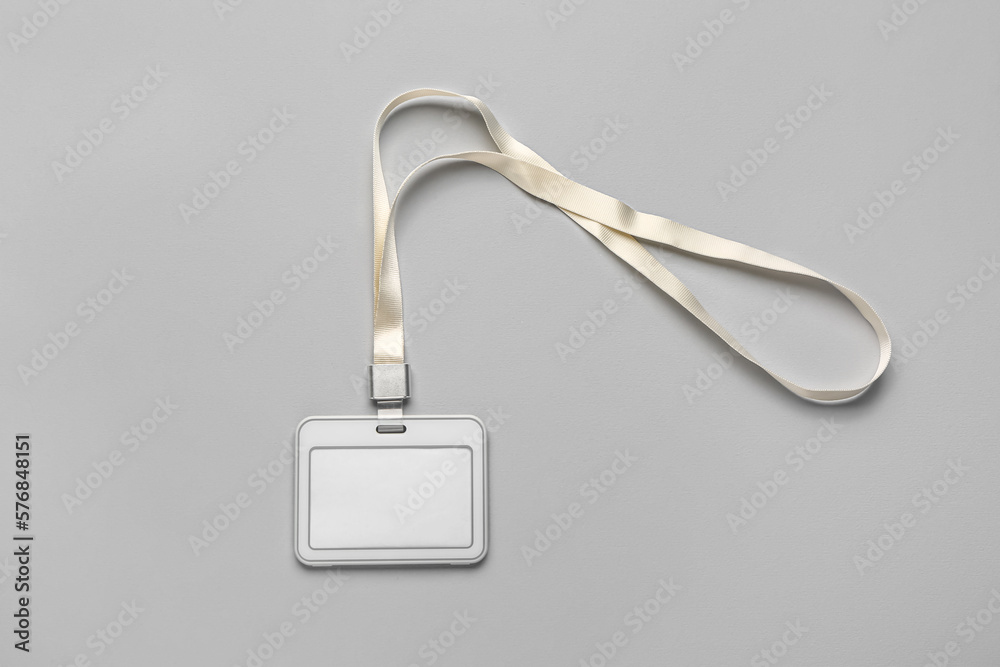 Blank badge with lanyard on grey background Blank badge with lanyard on grey background