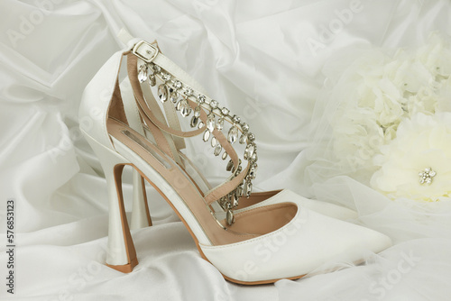 high heel shoes on a whiite silk background