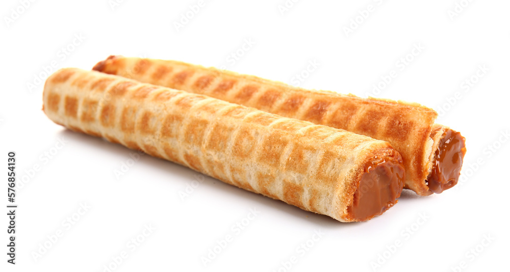 Delicious wafer rolls with boiled condensed milk isolated on white background Delicious wafer rolls with boiled condensed milk isolated on white background