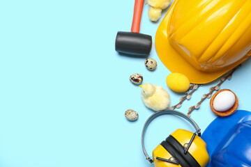 Builder's tools with chickens, Easter eggs and willow branches on blue background