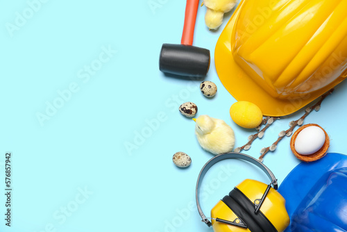 Canvas Print Builder's tools with chickens, Easter eggs and willow branches on blue backgroun