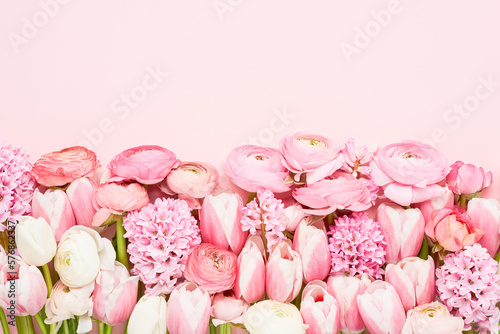 Pink spring flowers on a pink background. Mothers Day, Valentines Day, birthday concept