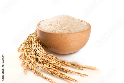 White rice in wooden bowl with ear paddy isolated on white background.