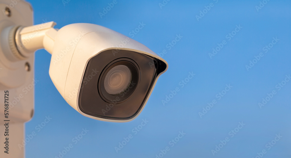 CCTV camera on blue sky background. Equipment for security systems and have copy space, close up CCTV camera on blue sky background. Equipment for security systems and have copy space, close up