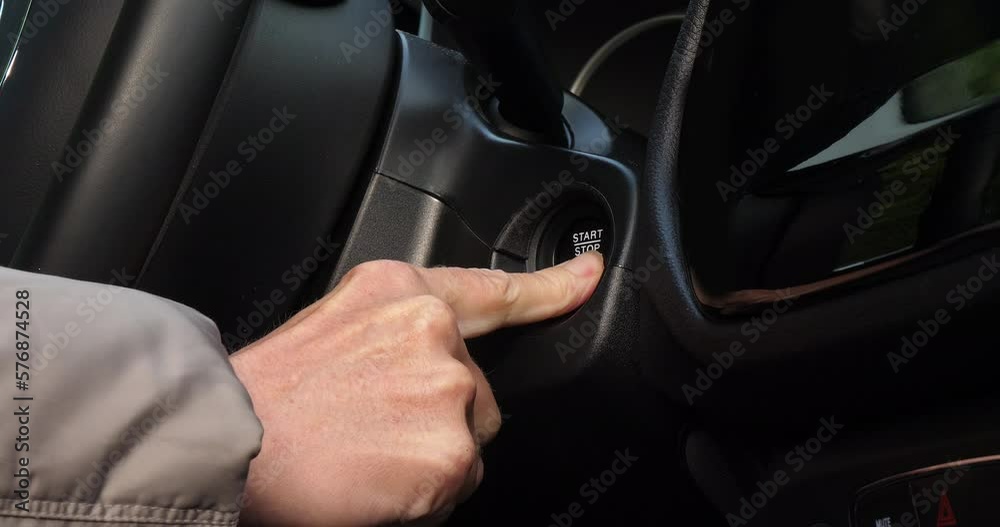 Woman in a car pressing the starter to start the engine, France, Slow motion 4K Woman in a car pressing the starter to start the engine, France, Slow motion 4K